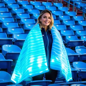 woman with heated blanket at sports event
