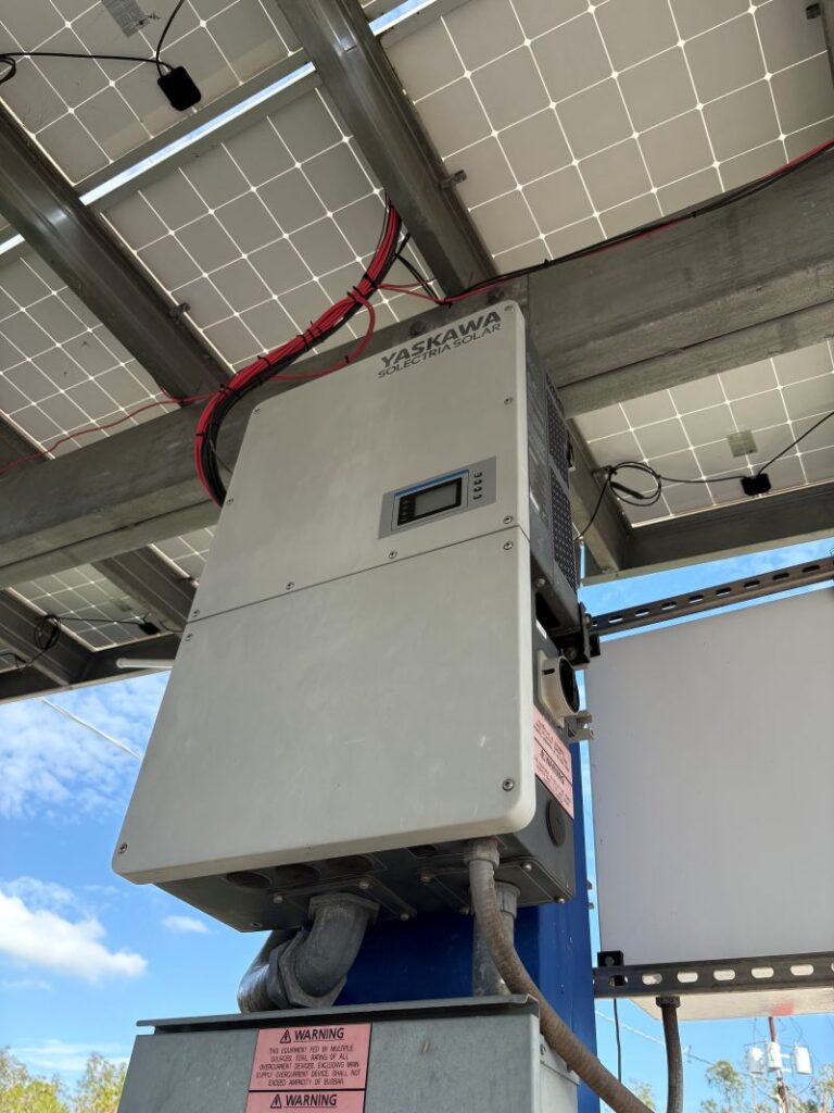 25 kW YASKAWA solar inverter mounted on a pole for a PV solar canopy.